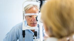 Senior man undergoing intraocular pressure exam at optometrist office
