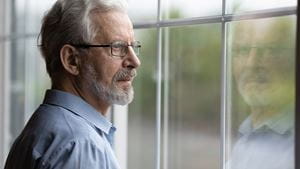 Pensive elderly mature senior man in eyeglasses looking in distance out of window, thinking of personal problems. Lost in thoughts elderly middle aged grandfather suffering from loneliness