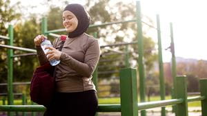 Middle-eastern female exercising in a park. About 25 years old, Arab woman