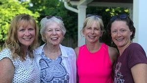 An elderly white woman and three middle-aged white women smile for a family picture