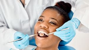 Shot of a young female patient having her teeth examined