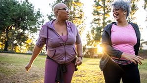 Two mature black women together in nature