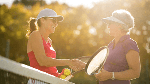Women shaking hands after tennis